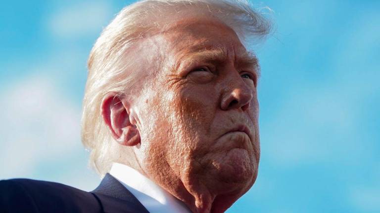 U.S. President Donald Trump speaks to members of the media upon his arrival from Pennsylvania, at Joint Base Andrews, Maryland, U.S., July 15, 2025. - REUTERSPIX