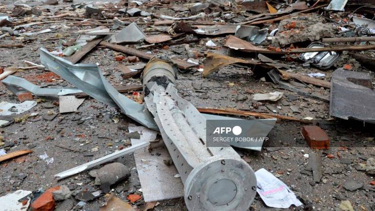 A view shows the internal components of a 300mm rocket which appear to contained cluster bombs launched from a BM-30 Smerch multiple rocket launcher in Ukraine’s second-biggest city of Kharkiv on March 3, 2022, following Russia’s invasion of Ukraine. - Sergey BOBOK / AFP