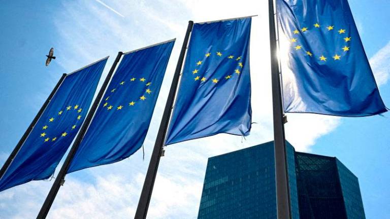 FILEpix: EU flags flutter in front of European Central Bank (ECB) headquarters in Frankfurt, Germany July 18, 2024. REUTERS