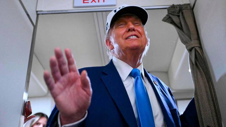 US President Donald Trump signed on Wednesday an executive order reviving sweeping restrictions that echo his first-term travel ban - AFPPIX