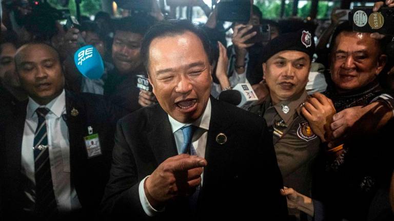 Bhumjaithai Party leader Anutin Charnvirakul (C) reacts as he leaves parliament following the announcement he had won most votes from MPs to become Thailand’s next prime minister in Bangkok on September 5, 2025. Thai conservative construction magnate Anutin Charnvirakul on September 5 won a parliament vote to serve as the nation’s next prime minister, according to an AFP tally of lawmakers’ ballots.