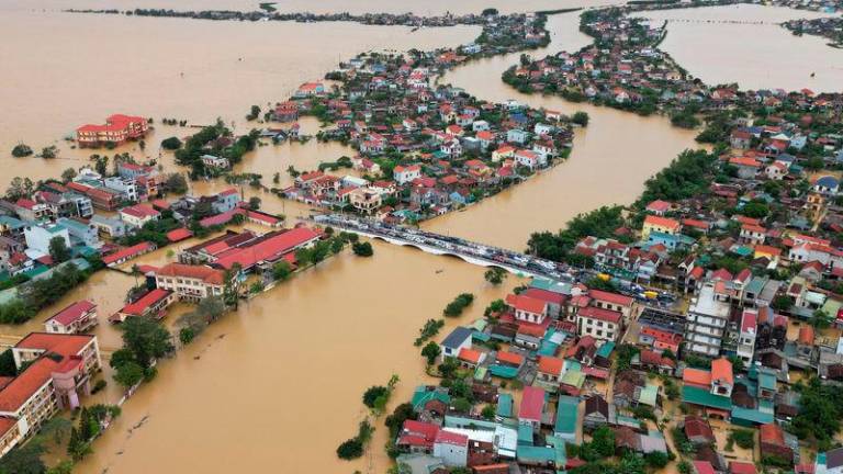 Flash flooding in central Vietnam killed five people, damaged hundreds of homes and destroyed crops - AFPpix