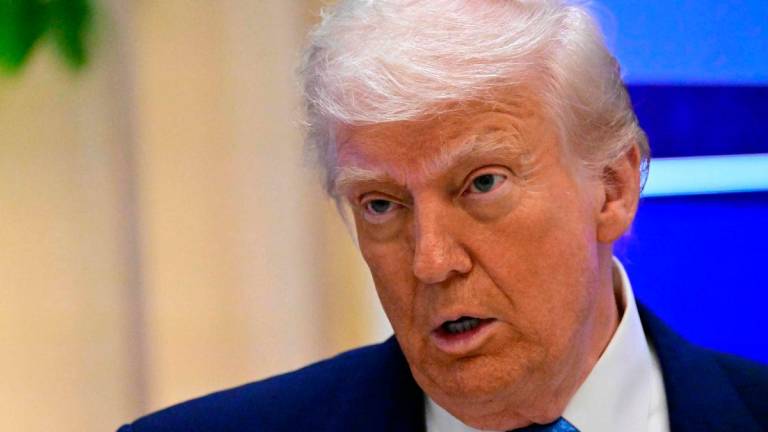 US President Donald Trump addresses a business forum in Abu Dhabi on May 16, 2025. AFPpix
