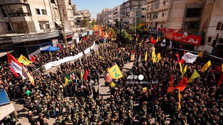 Lebanese Shiite Hezbollah supporters take part in a ceremony during the peak of Ashura, a 10-day period commemorating the seventh century killing of Prophet Mohammed’s grandson Imam Hussein, in Beirut’s southern suburbs on July 6, 2025. - ANWAR AMRO / AFP