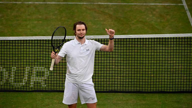 Italy’s Jannik Sinner reacts at the end of the men’s singles tennis match against Kazakhstan’s Alexander Bublikin at the Halle Open ATP tennis tournament in Halle, on June 19, 2025