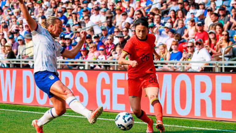 USA’s defender #02 Emily Sams (L) fights for the ball with China’s defender #26 Zhi Jie during the women’s international friendly football match between the USA and China at Allianz Field in Saint Paul, Minnesota, on May 31, 2025. AFPpix