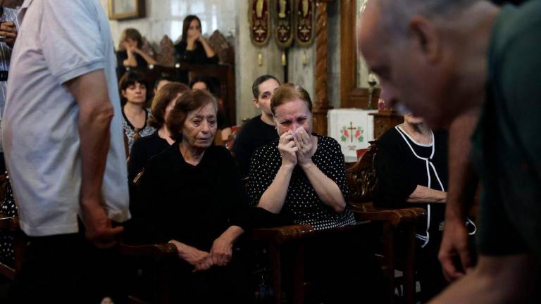 Christian Palestinians mourn Saad Salameh and Foumia Ayyad, killed earlier in an Israeli strike that hit the Holy Family Church in Gaza City - AFPPix
