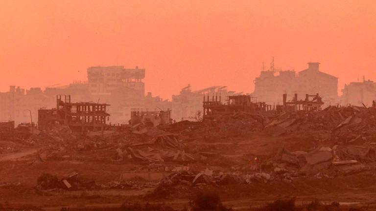 This picture, taken from a position on the Israeli border with the Gaza Strip, shows destroyed buildings in the besieged Palestinian territory - AFPPIX