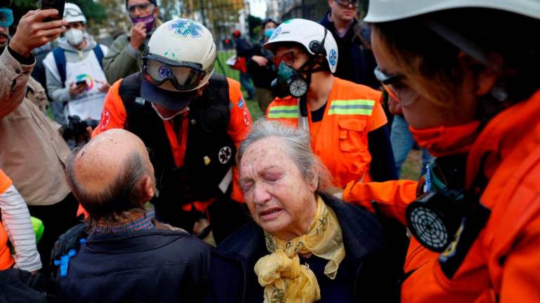 Healthcare workers help people during the weekly protest of pensioners against Argentine President Javier Milei’s austerity policies, outside the National Congress, in Buenos Aires, Argentina May 21, 2025. REUTERSpix