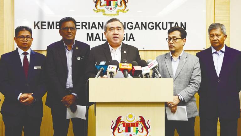 Loke speaking at a media briefing on the merger between CAAM and Mavcom in Putrajaya today. – Bernamapic