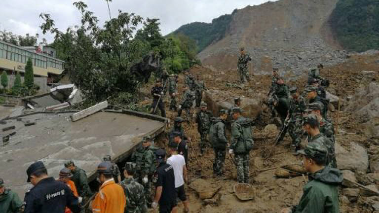 Missing in China landslide climbs to 32
