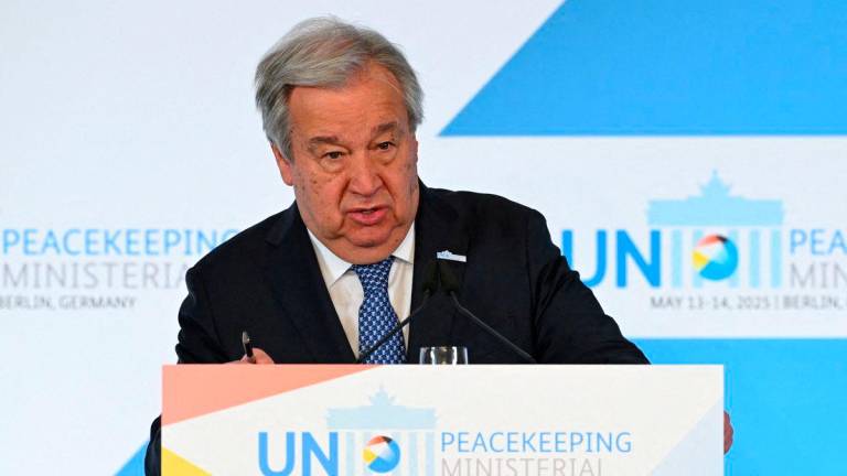 FILE PHOTO: UN Secretary-General Antonio Guterres attends a press conference with German Foreign Minister Johann Wadephul and German Defence Minister Boris Pistorius, during the United Nations Peacekeeping Ministerial, an international conference on peacekeeping missions, in Berlin, Germany May 14, 2025. REUTERS/Annegret Hilse/File Photo