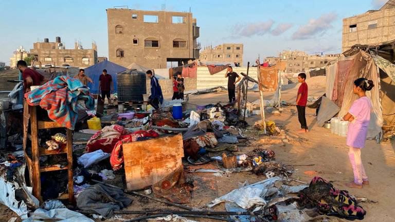 People inspect the damage after an Israeli strike on a camp housing displaced Palestinians in Khan Yunis in the southern Gaza Strip on July 2, 2025. - AFPpix