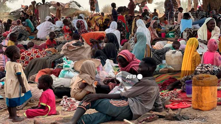 (FILES) People who fled the Zamzam camp for the internally displaced after it fell under RSF control, rest in a makeshift encampment in an open field near the town of Tawila in war-torn Sudan's western Darfur region on April 13, 2025. - AFP