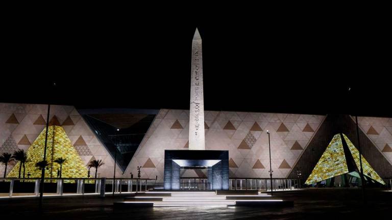 The Obelisk of Ramses II is pictured before the facade and entrance of the new Grand Egyptian Museum in Giza near Cairo - Photo by Ludovic MARIN / POOL / AFP