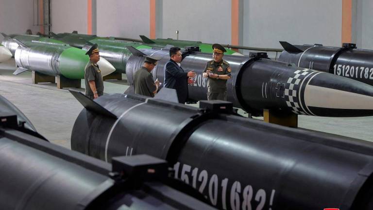 North Korean leader Kim Jong Un inspects a new missile production line at a military enterprise at an undisclosed location in this undated picture released by North Korea's official Korean Central News Agency, September 1, 2025. - KCNA via REUTERSPIX