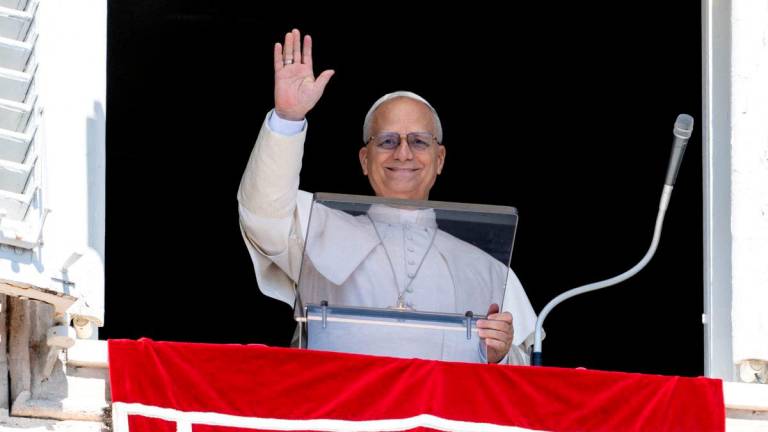 Pope Leo XIV leads the Angelus prayer from his window at the Vatican. Vatican Media/Mario Tomassetti/Handout via REUTERSPix