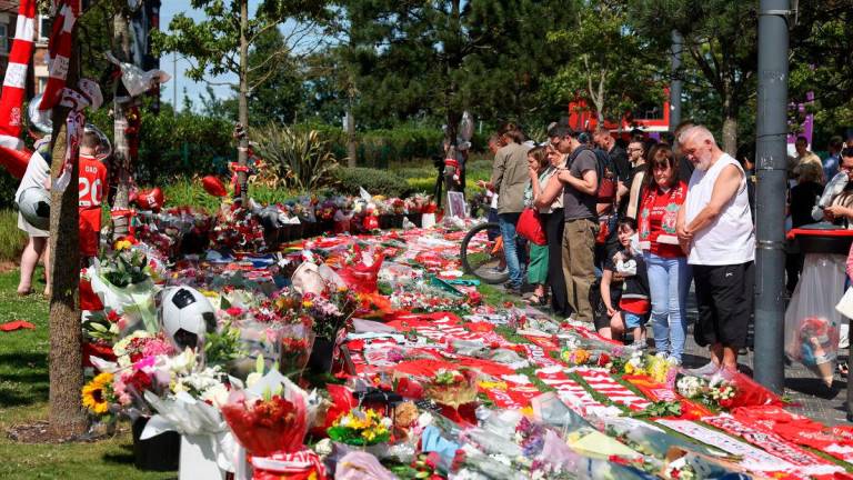 People pay tribute to Liverpool’s Portuguese soccer player Diogo Jota, who died in a car crash near Zamora, Spain, outside Anfield Stadium in Liverpool, Britain, July 3, 2025. REUTERS