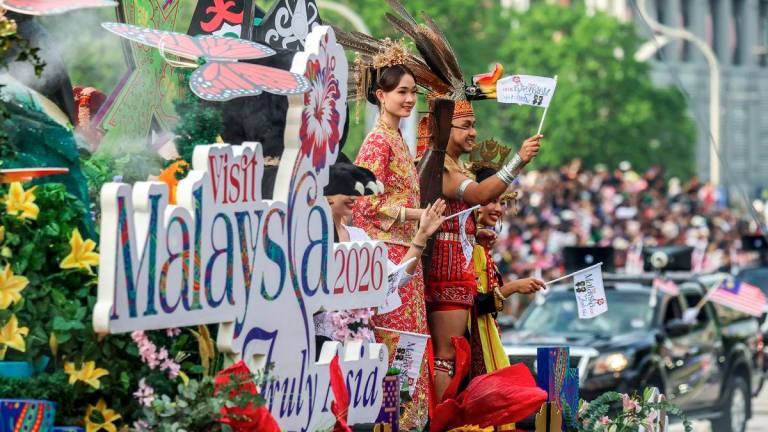 The Ministry of Tourism, Arts and Culture (MOTAC) leads the Visit Malaysia Year 2026 (VM2026) contingent, featuring decorated trishaws, flora and fauna displays, ethnic costumes, and traditional musical instruments such as the “sape” and “rebana ubi” - a vibrant showcase of Malaysia’s readiness to welcome visitors for VM2026 during the National Day 2025 celebration at Dataran Putrajaya today. - BERNAMA