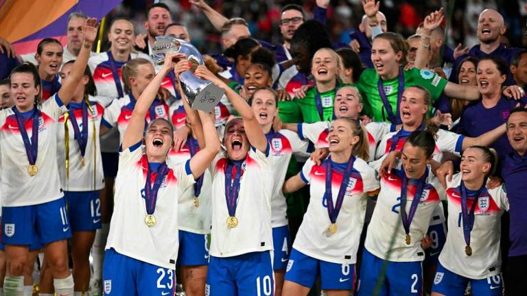 England's players lift the trophy as they celebrate winning the UEFA Women's Euro 2025 final football match between England and Spain at the St. Jakob-Park Stadium in Basel, on July 27, 2025. England beat Spain 3-1 on penalties to win the Women's Euro 2025. - AFPPIX