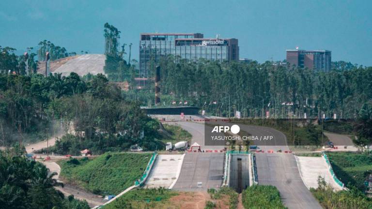 This picture taken on August 16, 2025, shows the building of Swissotel Nusantara in Ibu Kota Nusantara (IKN), the planned new capital of Indonesia, East Kalimantan. A year after it was inaugurated, Indonesia's would-be new capital Nusantara attracts tourists and construction workers, but most of its architecturally arresting presidential palace and freshly built avenues sit silent. - AFP