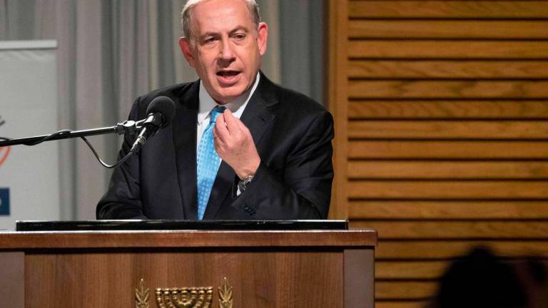 Israeli Prime Minister Benjamin Netanyahu delivers a speech before lighting the candles during the start of the Jewish light festival of Hanukkah in Rhavat Ronit, south of Netanya on December 24, 2016. AFPPix