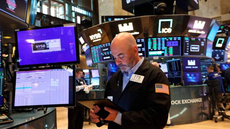 A trader works on the floor of the New York Stock Exchange (NYSE) at the opening bell in New York City, on May 27, 2025. Wall Street shares bounced on May 27. AFPpix