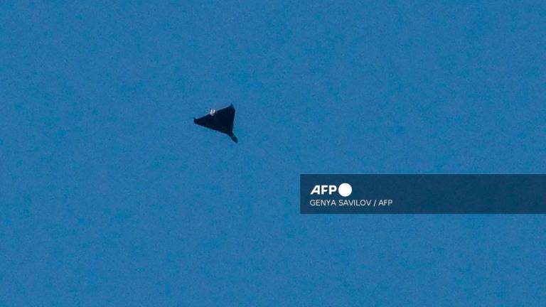 A Russian drone flies during drone and missile strikes in Kyiv on September 7, 2025, amid the Russian invasion of Ukraine. - Genya SAVILOV / AFP