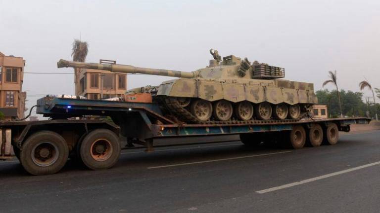 A truck transports an army tank on a road in Muridke, about 30 kilometres from Lahore, on May 7, 2025. AFPpix