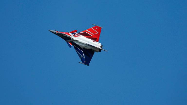 A Rafale fighter jet performs during an exhibition flight demonstration during the 55th edition of the International Paris Air Show at the Paris–Le Bourget Airport, in Le Bourget, suburb of Paris on June 16, 2025. - Alain JOCARD / AFP