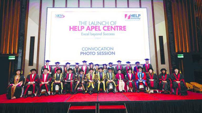 The cohort of HELP University APEL graduates at their convocation photo session