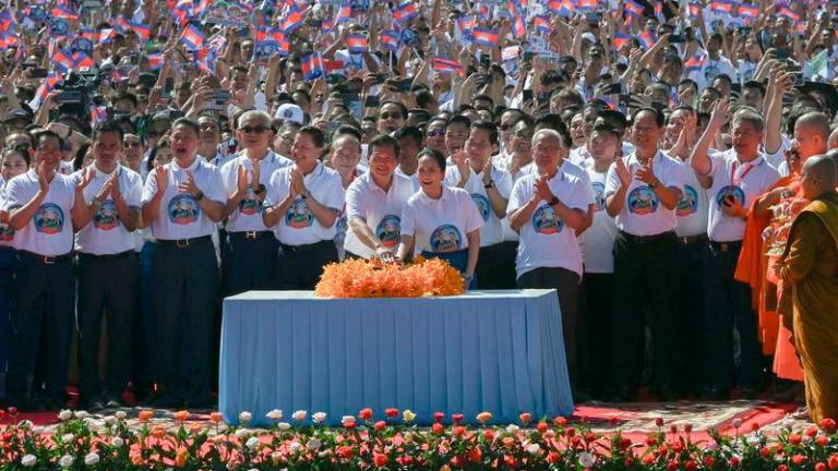 Cambodia’s Prime Minister Hun Manet and his wife (C) press a button to start the groundbreaking ceremony of the Funan Techo Canal in Kandal - AFPpix