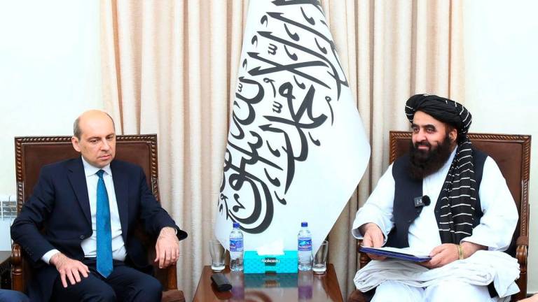 This handout photograph taken on July 3, 2025 and released by Afghanistan’s Ministry of Foreign Affairs shows Afghanistan’s Foreign Minister Amir Khan Muttaqi (R) meeting with Russia’s ambassador to Afghanistan Dmitry Zhirnov