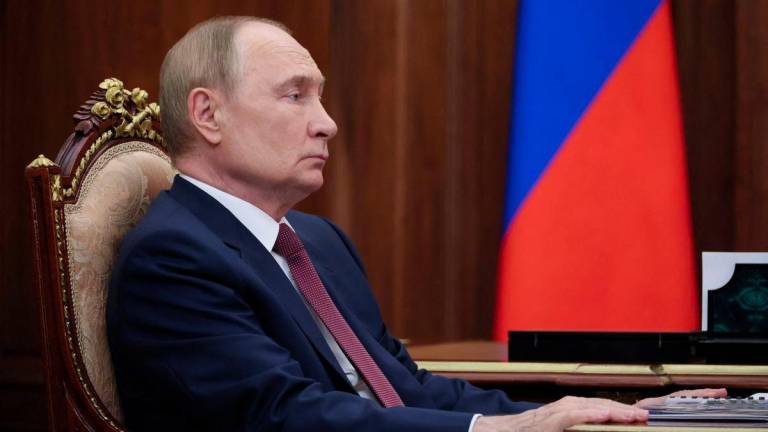 Russian President Vladimir Putin attends a meeting with Rostov Region Acting Governor Yury Slyusar at the Kremlin in Moscow, Russia August 18, 2025. Sputnik/Vyacheslav Prokofyev/Pool via REUTERSPIX