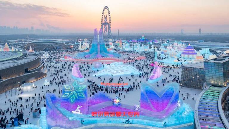 An aerial drone photo shows a view of the Harbin Ice-Snow World in Harbin, northeast China’s Heilongjiang Province, Dec. 21, 2024. (Xinhua/Xie Jianfei)