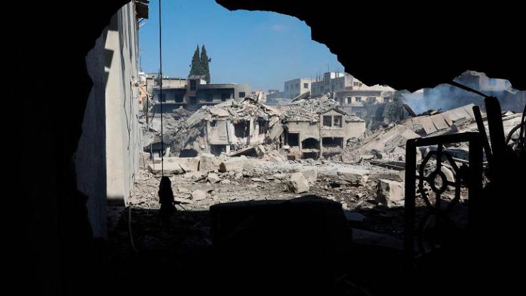 A view shows damage in the aftermath of what security sources said was an Israeli strike on a commercial market, amid the ongoing hostilities between Hezbollah and Israeli forces, in Nabatieh, southern Lebanon, October 13, 2024. - REUTERS/Mohammed Yassin