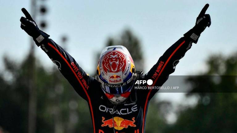 Red Bull Racing’s Dutch driver Max Verstappen celebrates after winning the Italian Formula One Grand Prix at the Autodromo Nazionale Monza circuit, in Monza, northern Italy, on September 7, 2025. (Photo by Marco BERTORELLO / AFP)