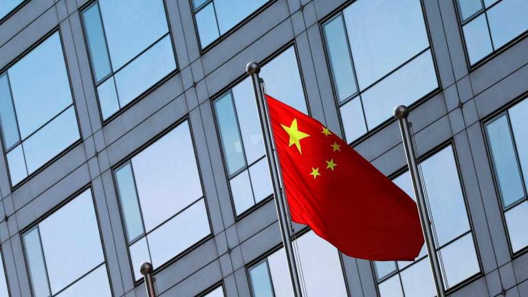 For representational purposes only: FILE PHOTO: A Chinese flag flutters outside the China Securities Regulatory Commission (CSRC) building on the Financial Street in Beijing, China February 8, 2024. REUTERS/Florence Lo/File Photo