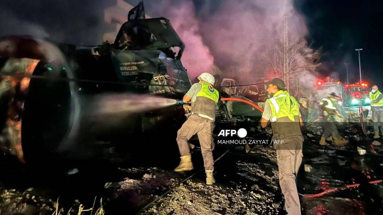 Firefighters douse the flames at the site of an overnight Israeli strike in Al-Msayleh area in southern Lebanon on October 11, 2025. Lebanese President Joseph Aoun condemned Israel on October 11 for carrying out overnight strikes on civilian facilities that the health ministry said killed at least one person. - AFP