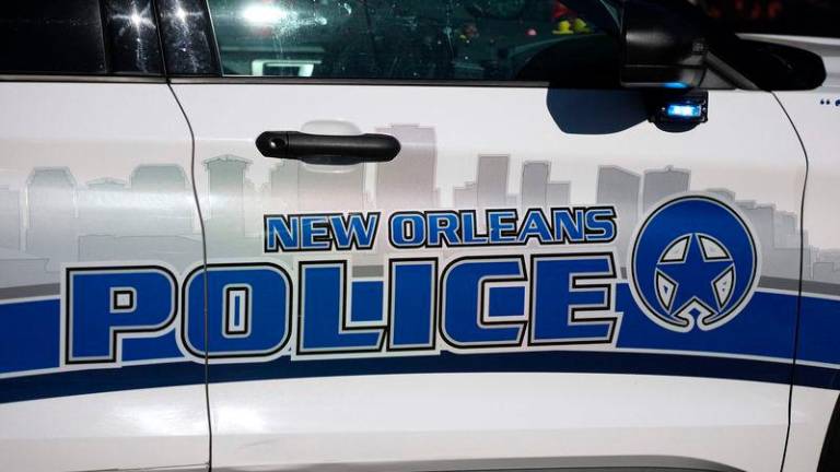 A police car on scene outside a house fire on Mandeville Street that may be connected to the mass casualty Bourbon Street attack - AFPpix