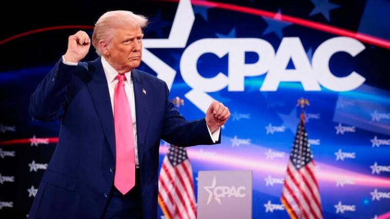 U.S. President Donald Trump reacts to the crowd while arriving at the Conservative Political Action Conference (CPAC) at the Gaylord National Resort Hotel and Convention Center on February 22, 2025 in Oxon Hill, Maryland. AFPpix