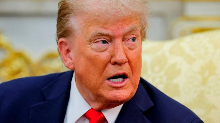 U.S. President Donald Trump reacts as he and the President of Poland Karol Nawrocki (not pictured) meet in the Oval Office at the White House in Washington, D.C., U.S., September 3, 2025. - REUTERSPIX