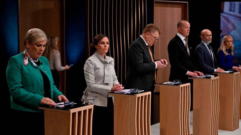 Presidential candidates, including front runners, former Icelandic Prime Minister Katrin Jakobsdottir (2nd L) and Halla Tomasdottir (L) take part in a debate in Reykjavik on May 31, 2024. Iceland will elect a new President on Saturday. - AFPPIX
