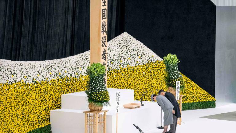 Japan’s Emperor Naruhito (R) and Empress Masako bow as they attend a memorial service marking the 80th anniversary of Japan’s surrender in World War II at the Nippon Budokan hall in Tokyo on August 15. AFPPix