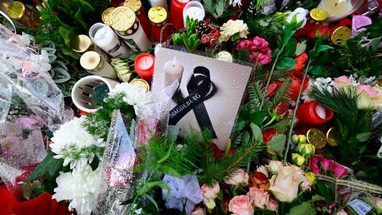 Tributes to the victims are seen outside the Johanniskirche (Johannes Church), a makeshift memorial near the site of a car-ramming attack on a Christmas market in Magdeburg, eastern Germany - AFPpix