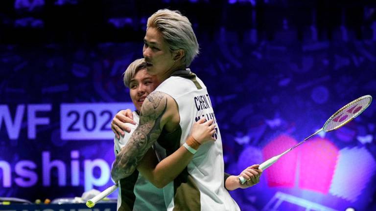 Malaysia’s Ee Wei Toh (L) and Tang Jie Chen celebrate their victory over India's Dhruv Kapila and Tanisha Crasto at the end of their mixed double match at the Badminton BWF World Championships at the Adidas Arena in Paris, on August 29, 2025. - AFPPIX