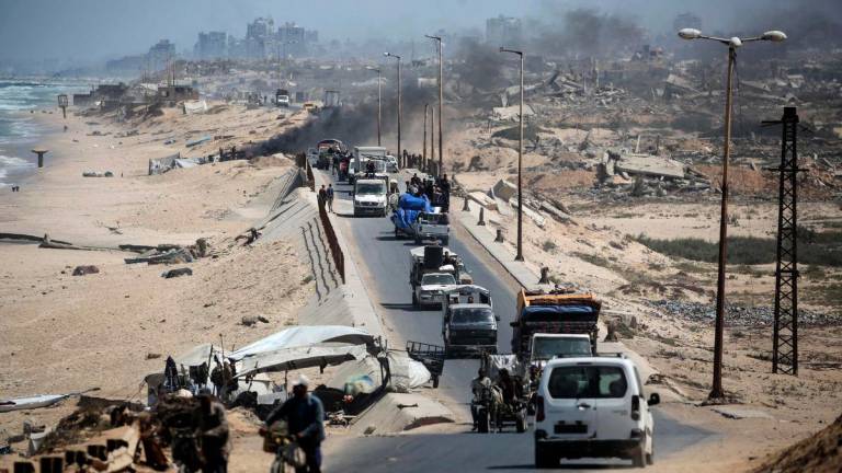Displaced Palestinians flee Gaza City towards the southern areas of the Gaza Strip, in Nuseirat, on August 28, 2025, as the war between Israel and the Hamas militants movement continues. The Israeli military pressed operations around Gaza City on as US President Donald Trump hosted a meeting on post-war plans for the shattered Palestinian territory. (Photo by Eyad BABA / AFP)