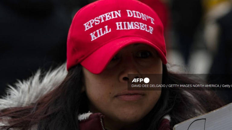 People gather to protest human trafficking at the Thurgood Marshall United States Courthouse where the trial of Ghislaine Maxwell is being held on November 29, 2021 in New York City. - AFP