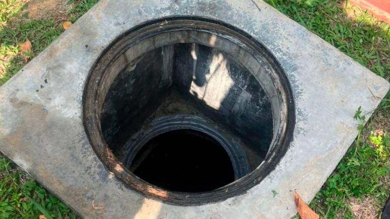 Sewage pithole at the Lenggeng school. - via social media