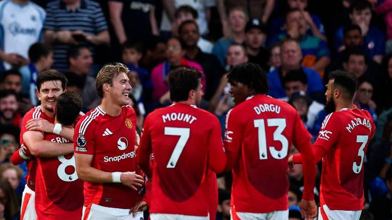 Manchester United’s English defender #05 Harry Maguire (L) celebrates after scoring a goal that is disallowed due to an offside position during the English Premier League football match between Chelsea and Manchester United at Stamford Bridge in London on May 16, 2025. AFPpix